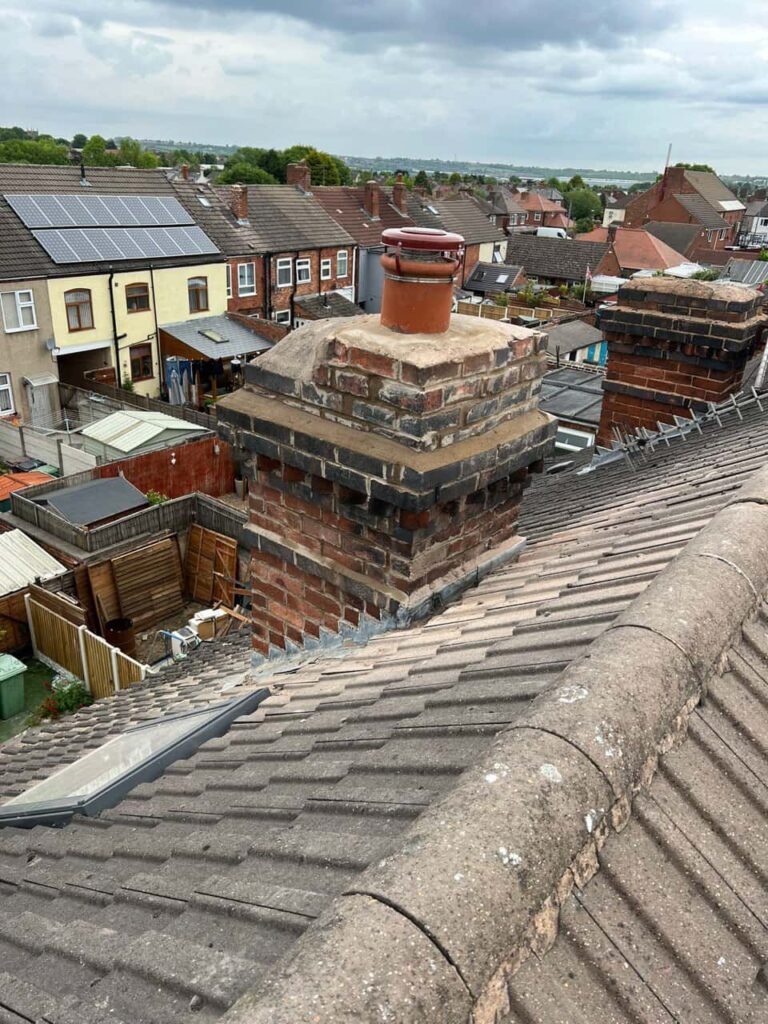 This is a photo taken from a roof which is being repaired by Great Barr Roofing Repairs, it shows a street of houses, and their roofs